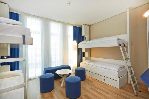 Ліжко або ліжка в номері H2 Hotel München Messe