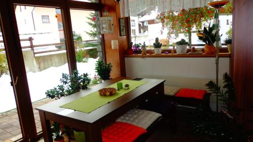 a small table in a room with a window at Haus Bergkristall in Längenfeld