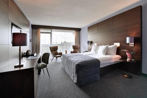 Cama ou camas em um quarto em Van der Valk Hotel Sassenheim - Leiden