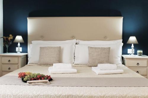 A bed or beds in a room at AHR Leonis Residence La Maddalena