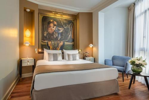 Cama ou camas em um quarto em Hôtel Le Walt by Inwood Hotels