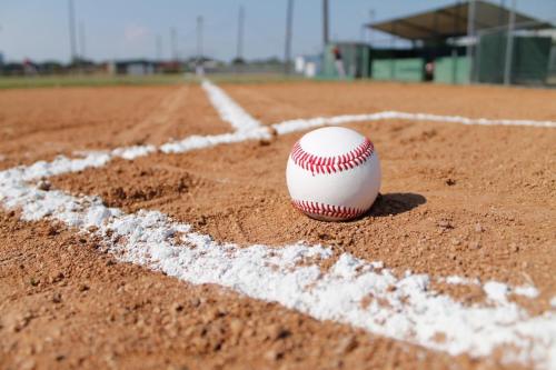 uma bola branca sentada num campo de basebol em Holiday Inn Express Baltimore West - Catonsville, an IHG Hotel em Catonsville