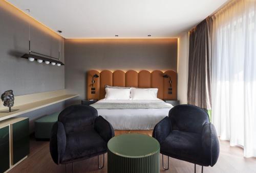 Cama ou camas em um quarto em La Suite Matera Hotel & Spa