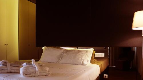 Cama ou camas em um quarto em Agrinho Suites & Spa Gerês