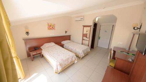 Tempat tidur dalam kamar di Yel Holiday Resort