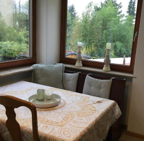 a table and chairs with a table and a window at Beletage in Neuwied