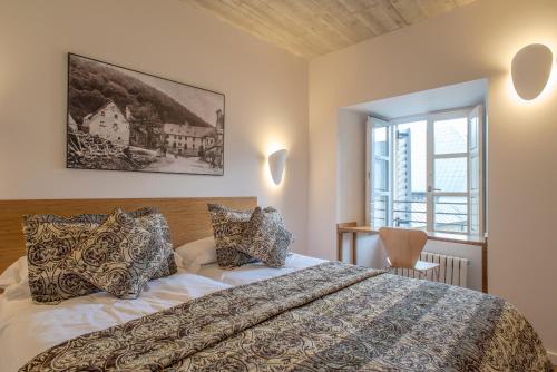 Krevet ili kreveti u jedinici u okviru objekta Hotel Roncesvalles