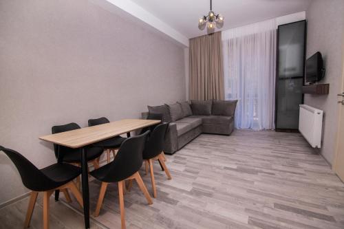 Телевизор и/или развлекательный центр в Apartment Didveli 7