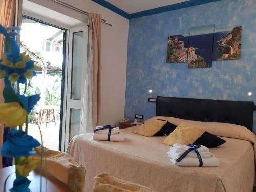 Кровать или кровати в номере B&B Ravello Rooms