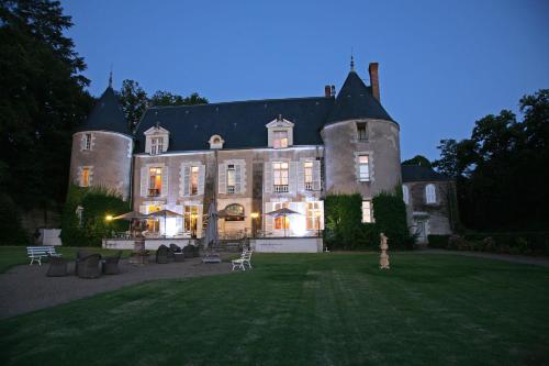 a large house with a grass yard in front of it at Château De Pray in Amboise