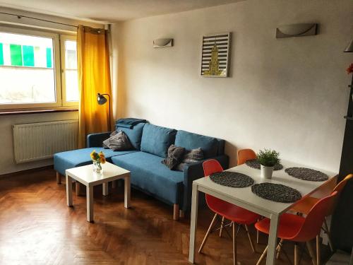 A seating area at Apartament ul.Złota z widokiem na Pałac Kultury!!!