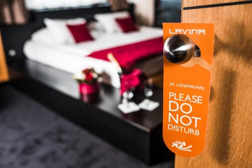 Un ou plusieurs lits dans un hébergement de l'établissement Hotel Lavina