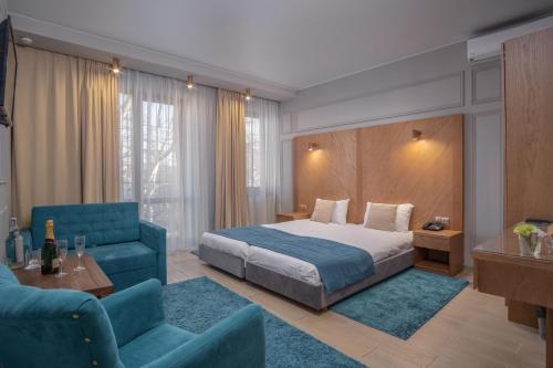 Posteľ alebo postele v izbe v ubytovaní Boomerang Boutique Hotel