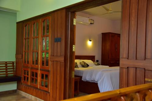 A bed or beds in a room at Royal KazBay Beach Resort