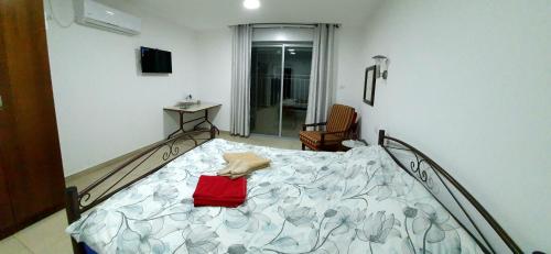 A bed or beds in a room at Herodion Hotel-Bethlehem