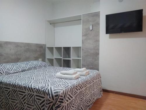 Giường trong phòng chung tại Departamento Estudio 3