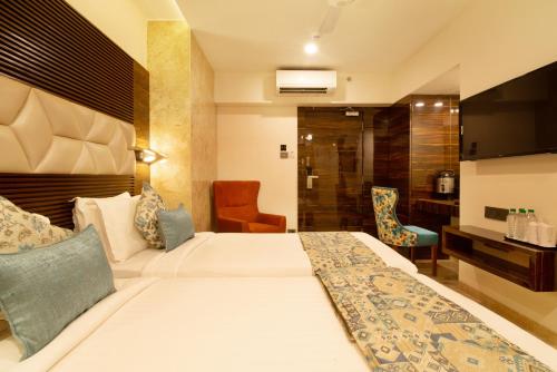 Tempat tidur dalam kamar di Hotel Auris & Banquets, Mumbai International Airport