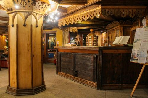 a bar in a room with wooden walls at Grand Hotel Sestriere in Sestriere