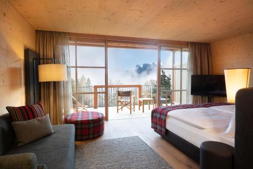 เตียงในห้องที่ ADLER Lodge RITTEN