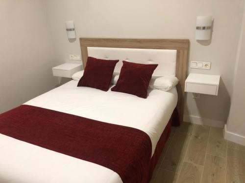 Voodi või voodid majutusasutuse Pinar Malaga Rooms toas