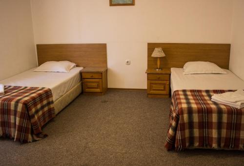 A bed or beds in a room at Family Hotel Saint Iliya