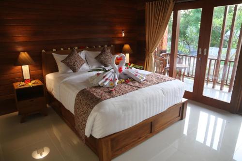 Cama ou camas em um quarto em Karang Agartha Lembongan