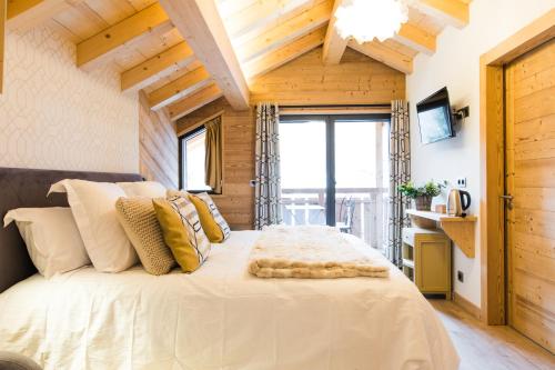 Cama ou camas em um quarto em Chalet sur les monts Morzine