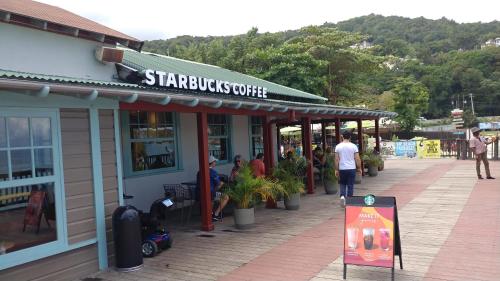 a store with people standing outside of it at SandCastles Holiday #C9 in Ocho Rios