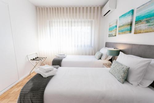 Una cama o camas en una habitación de Mumadona Apartment