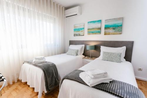 Una cama o camas en una habitación de Mumadona Apartment