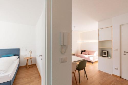 A bed or beds in a room at Hus Appartement - Nr. 3