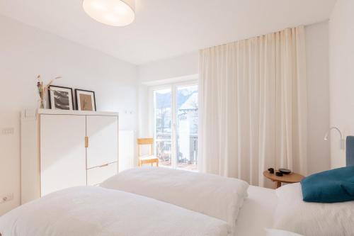 A bed or beds in a room at Hus Appartement - Nr. 3