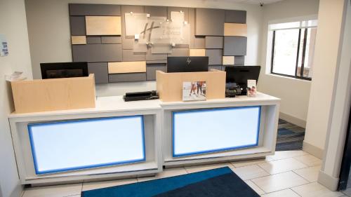 a counter with two boxes on top of it at Holiday Inn Express & Suites Colorado Springs North, an IHG Hotel in Colorado Springs