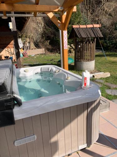 a jacuzzi tub sitting under a gazebo at Panni Vendégház in Egerszalók