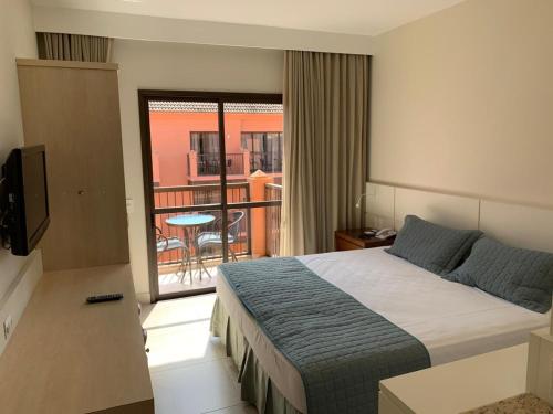 Una cama o camas en una habitación de Jurerê Beach Village - Flat na Praia