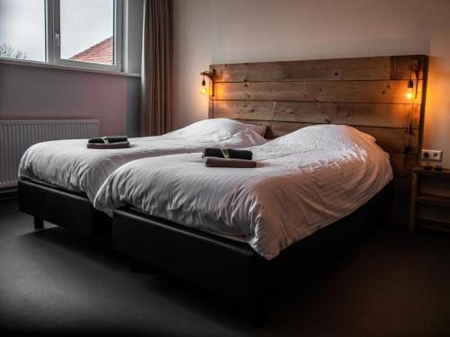 Una cama o camas en una habitación de B&B bij de 3 linden