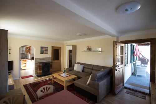 a living room with a couch and a table at Haus Bergland in St. Wolfgang