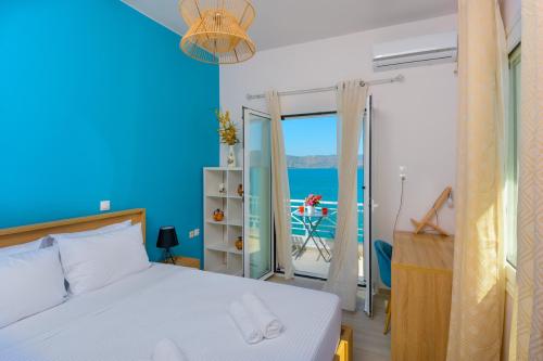 A bed or beds in a room at Margarita's Seafront Luxury Apartment