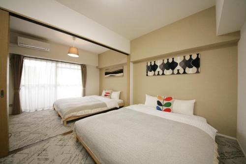 goom Hotel Fukuoka-Tenjin房間的床