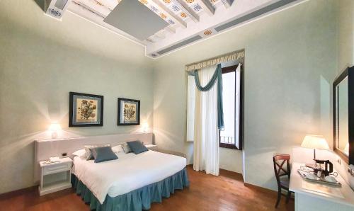 Posteľ alebo postele v izbe v ubytovaní B&B La Signoria Di Firenze