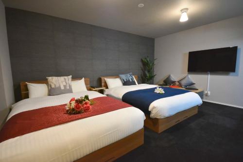 Cama ou camas em um quarto em The Grand Residence Hotel Tenjin