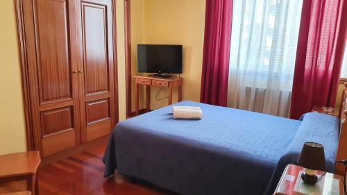 Giường trong phòng chung tại Pensión Residencia Buenos Aires