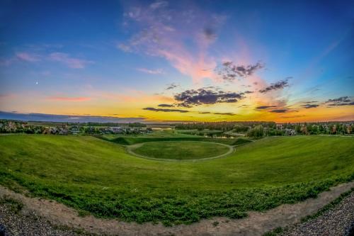 an aerial view of a golf course at sunset at Baltas gandras in Naisiai