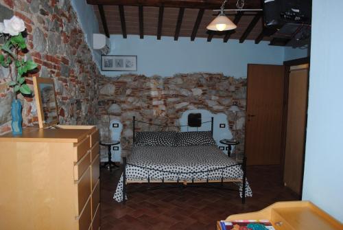 Cama ou camas em um quarto em Podere San Paolo