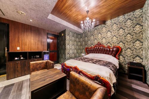 Кровать или кровати в номере Hotel Luna Ibaraki(Adult Only)