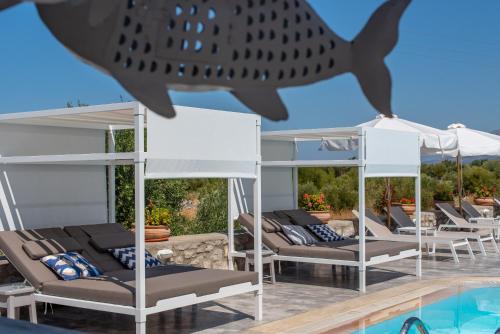 a shark on the roof of a villa with a swimming pool at Kastro Maini in Areopolis