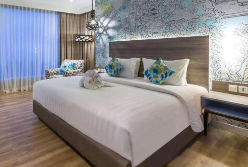 Wyndham Garden Kuta Beach Bali में एक कमरे में एक या कई बेड