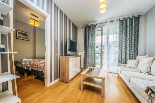 Televizors / izklaižu centrs naktsmītnē Apartament Lemon