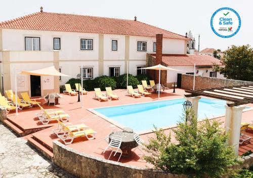 The swimming pool at or close to Casa Da Padeira - Turismo Rural