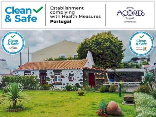 a picture of a house with the clean and safe logo at Fisherman's House Azores in Angra do Heroísmo